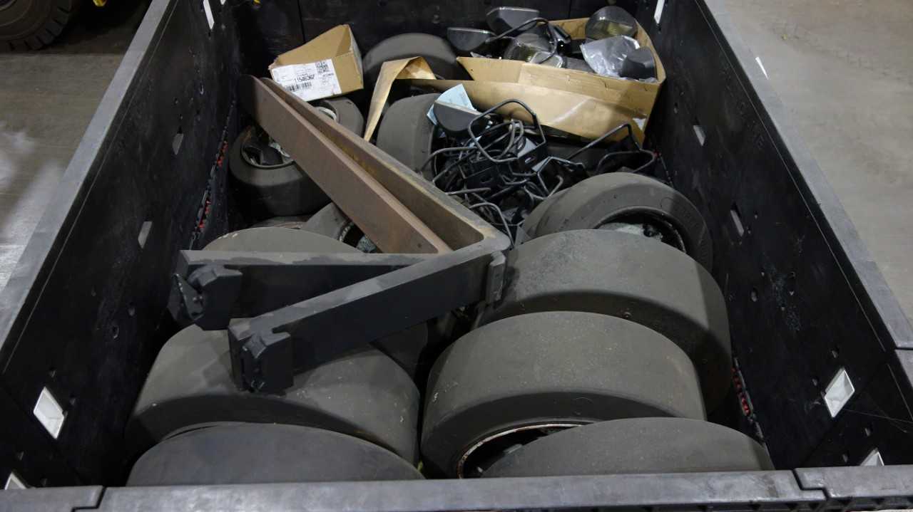 1 CRATE OF ASSORTED FORKLIFT SPARES, SUPER SOLID TIRES, HEADLIGHTS, FORKS - MATERIAL HANDLING