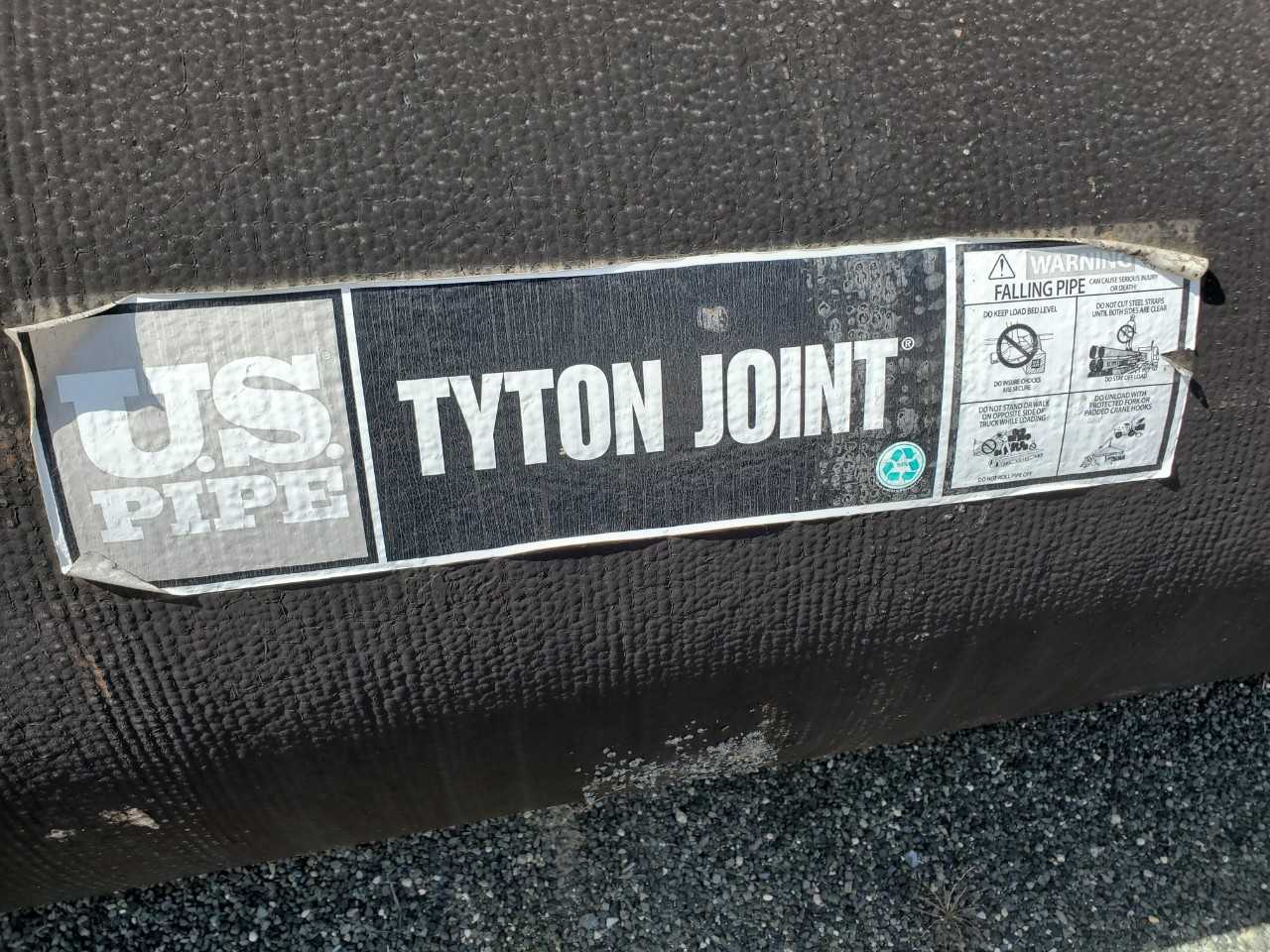 ROW OF ASSORTED US PIPE TYTON JOINT DUCTILE IRON PIPES, 12IN,16IN,18IN, 24IN, 30IN - HAND TOOLS