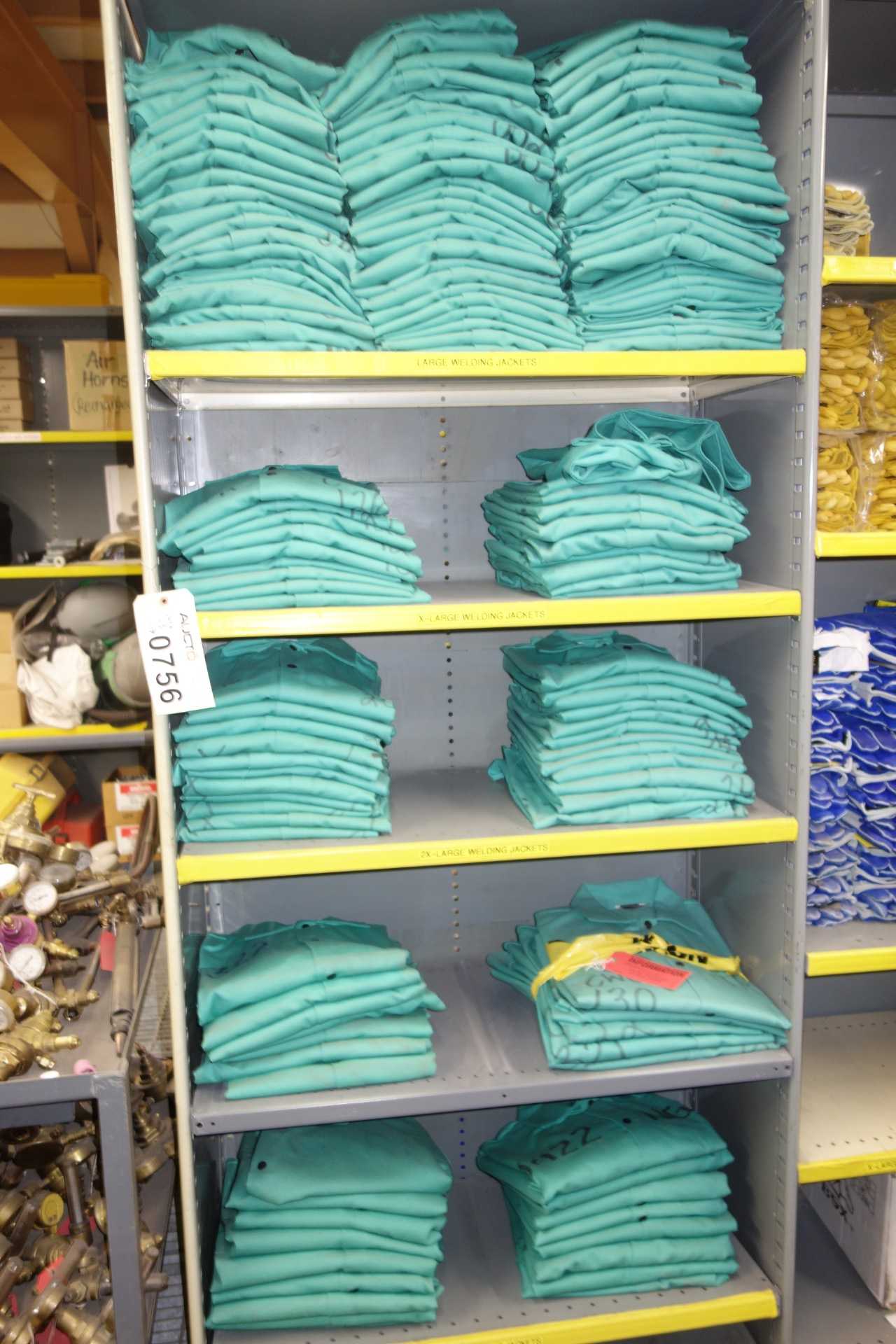 Contents of 3x sections shelving - welding jackets, gloves, leather chaps - SHELVING