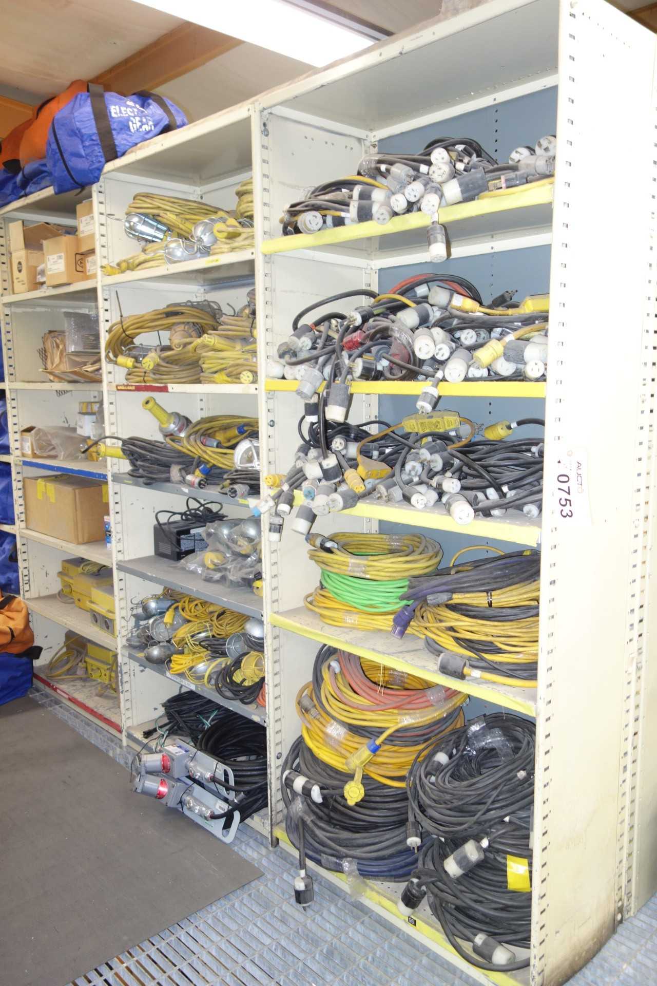 Contents of 3x sections shelving - lighting, extension cords, low voltage transformers - SHELVING