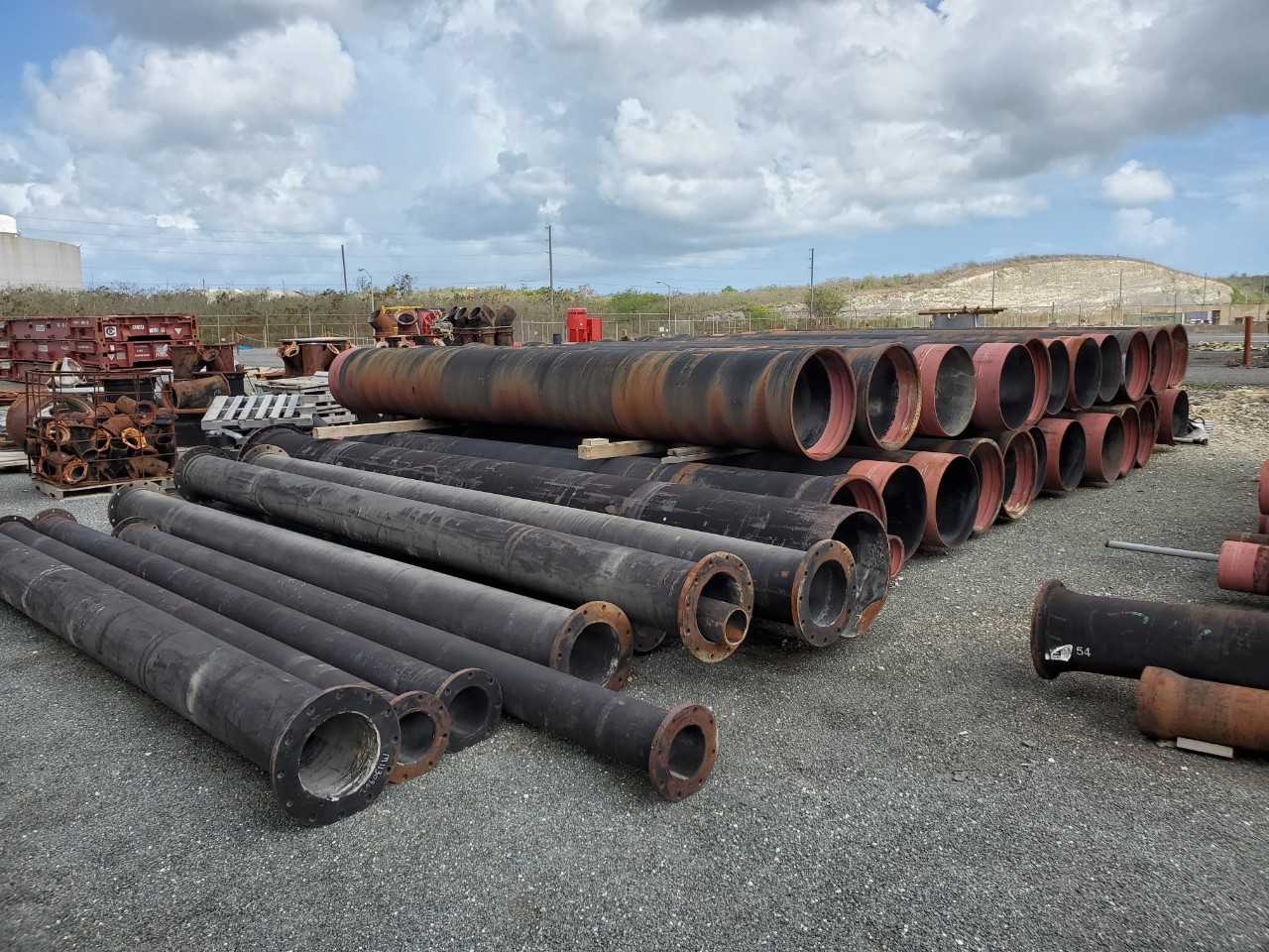 ROW OF ASSORTED US PIPE TYTON JOINT DUCTILE IRON PIPES, 8IN, 12IN, 24IN - HAND TOOLS
