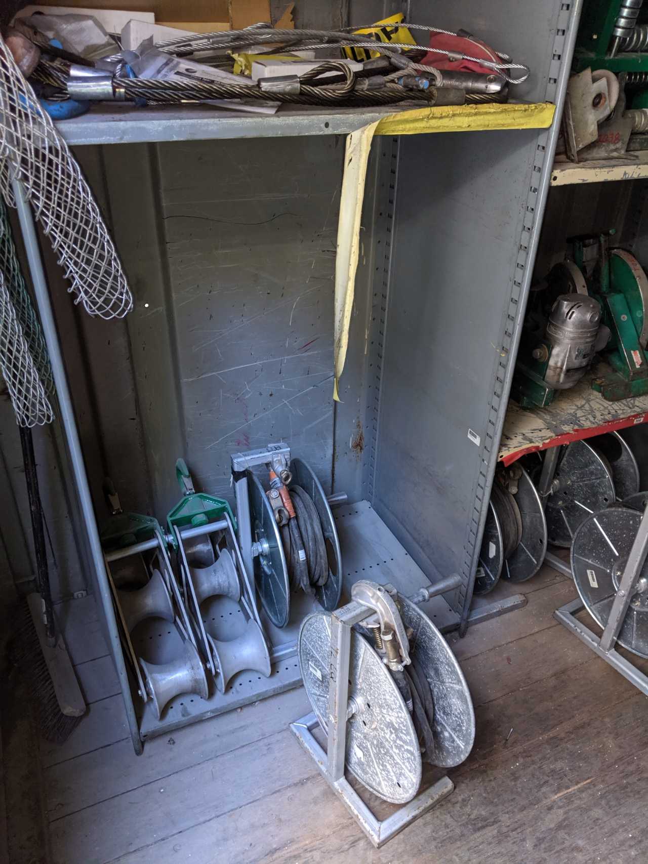 Contents of Conex - conduit benders, cable pullers, grounding clamps, hose reels - ELECTRIC POWER TOOLS