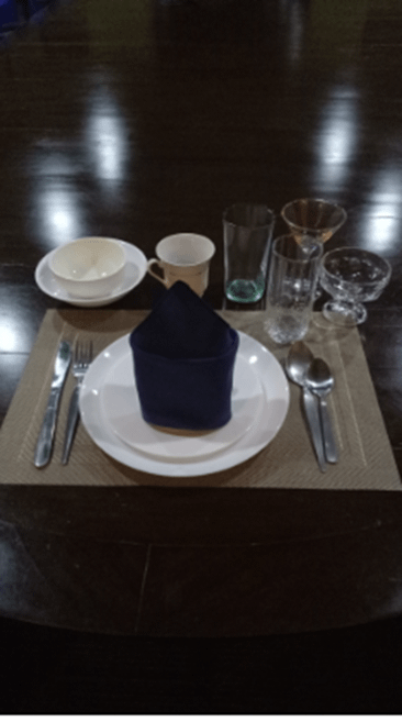 1 Lot of Silverware, Placemats, Cups, Glasses, Cloth Napkins, Plates, and Bowls (Approx. 143 Pieces Total) - MISCELLANEOUS