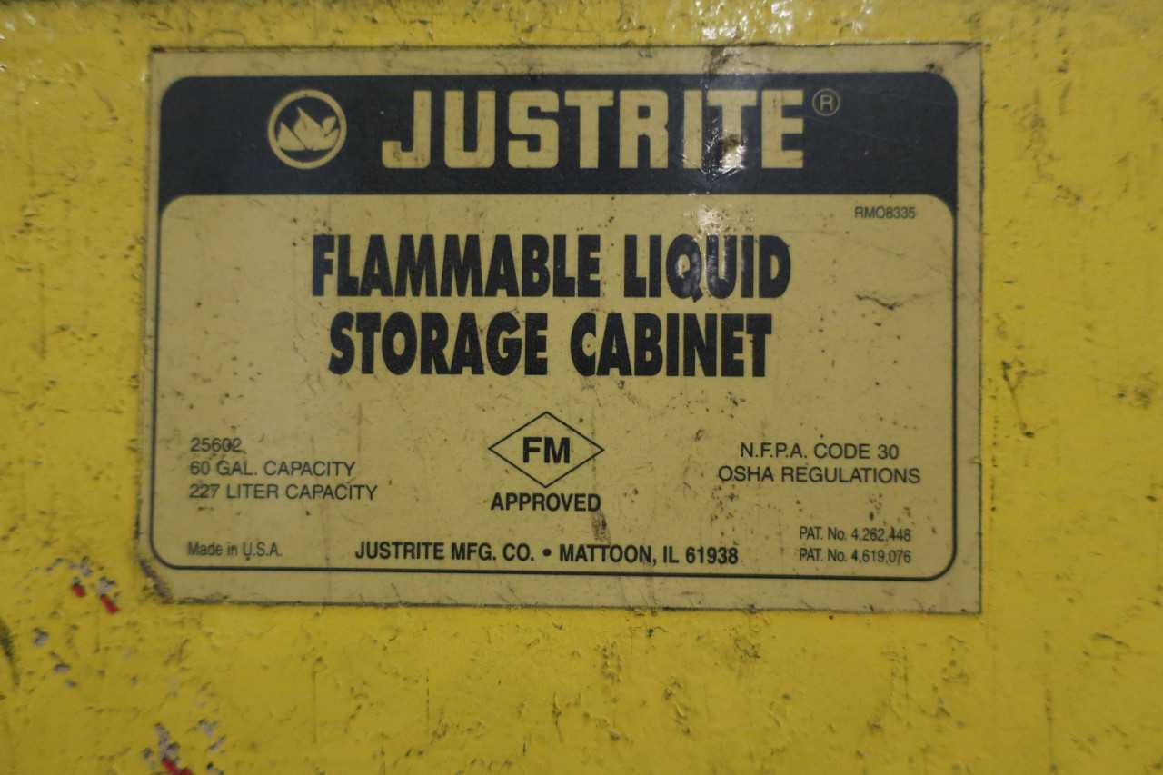 FLAMMABLE LIQUIDS STORAGE CABINET WITH CANTENT GASOLINE CANS - SAFETY EQUIPMENT