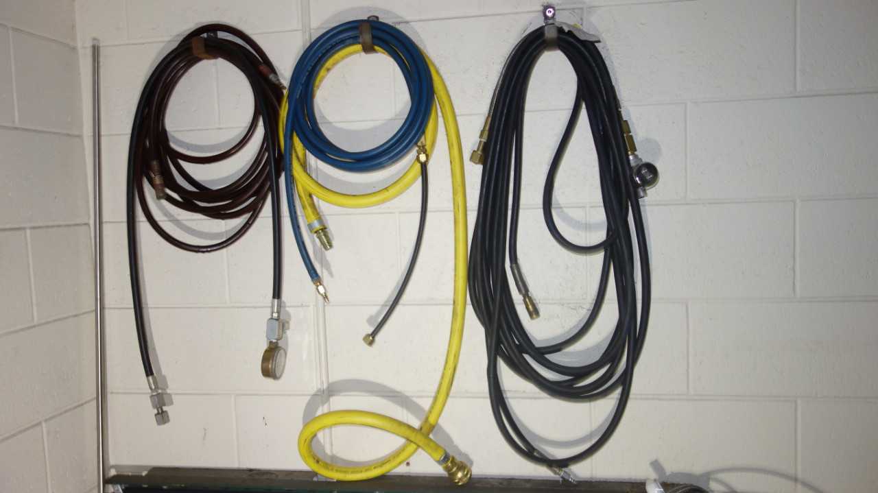 CONTENTS OF WALL SECTION, ASSORTED CABLES, HOSES - INDUSTRIAL PARTS