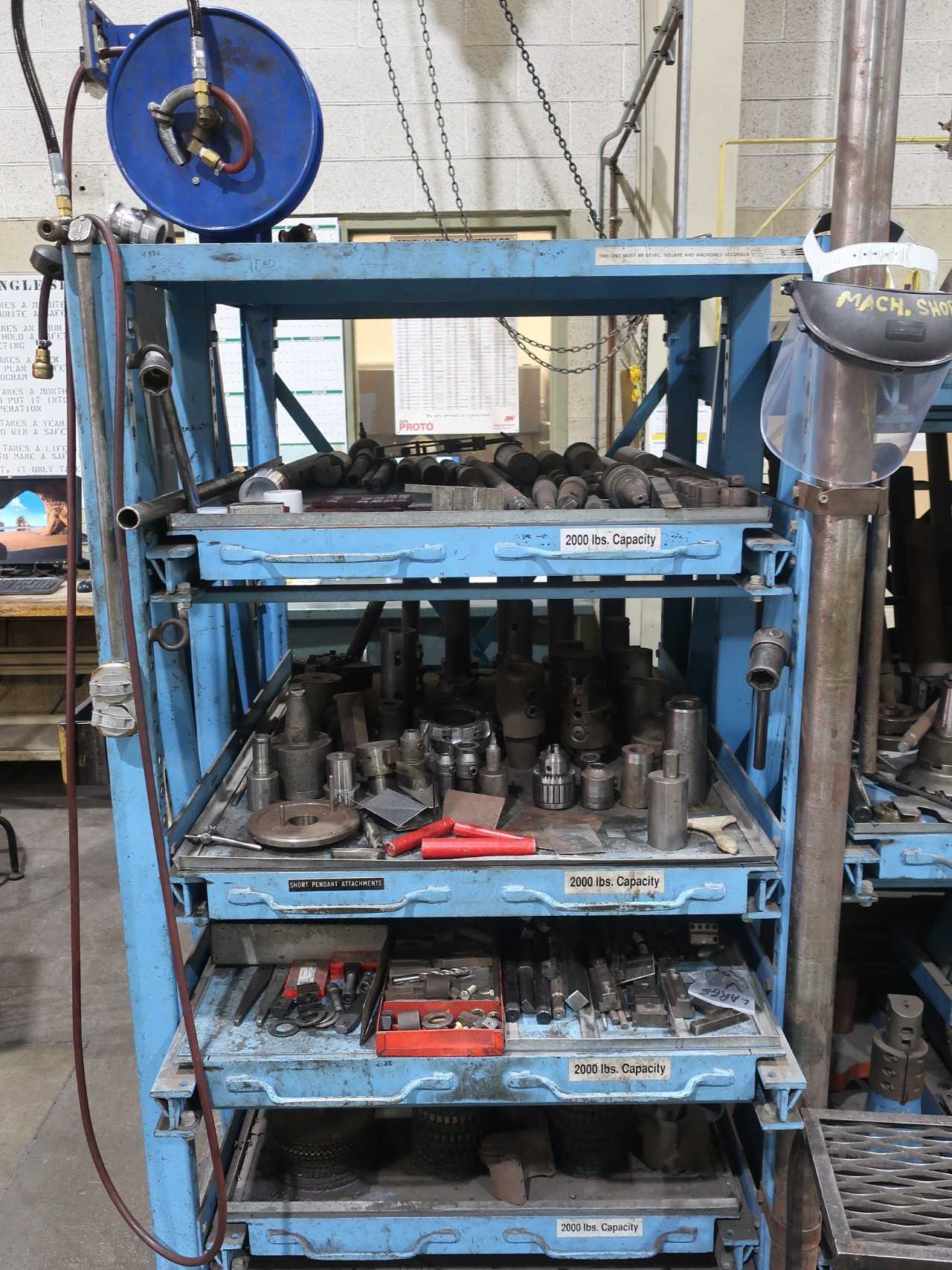 Assorted machine tooling and accessories for horizontal mill, with blue shelving - MILLING MACHINES