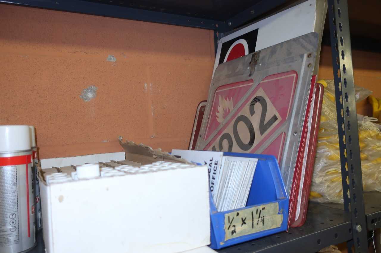 CONTENTS OF SHELF, ASSORTED SAFETY SUPPLIES, GLOVES, FIRST AID KIT, SPILL KIT, SAFETY SIGNS - SAFETY EQUIPMENT