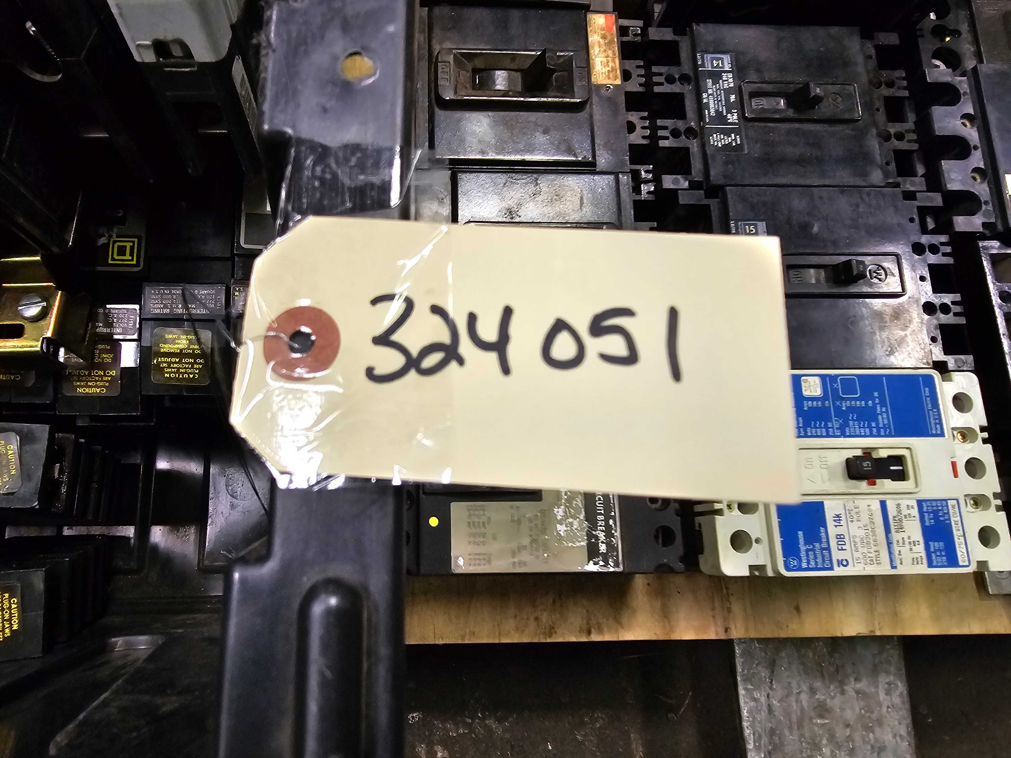 LOT OF CIRCUIT BREAKERS - BIN AND BREAKERS NEXT TO IT INCLUDED - CIRCUIT BREAKERS