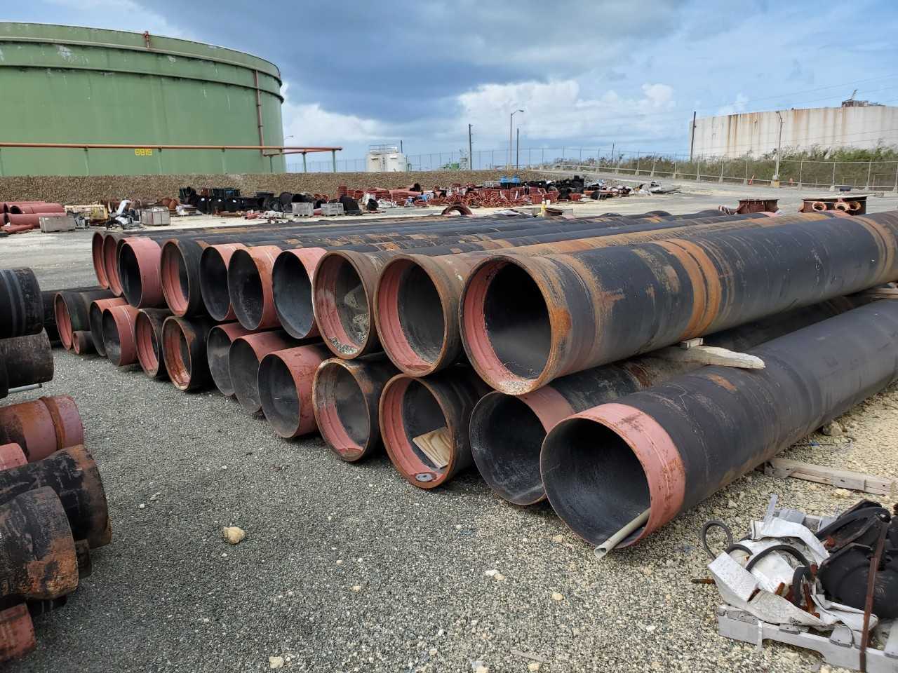ROW OF ASSORTED US PIPE TYTON JOINT DUCTILE IRON PIPES, 8IN, 12IN, 24IN - HAND TOOLS