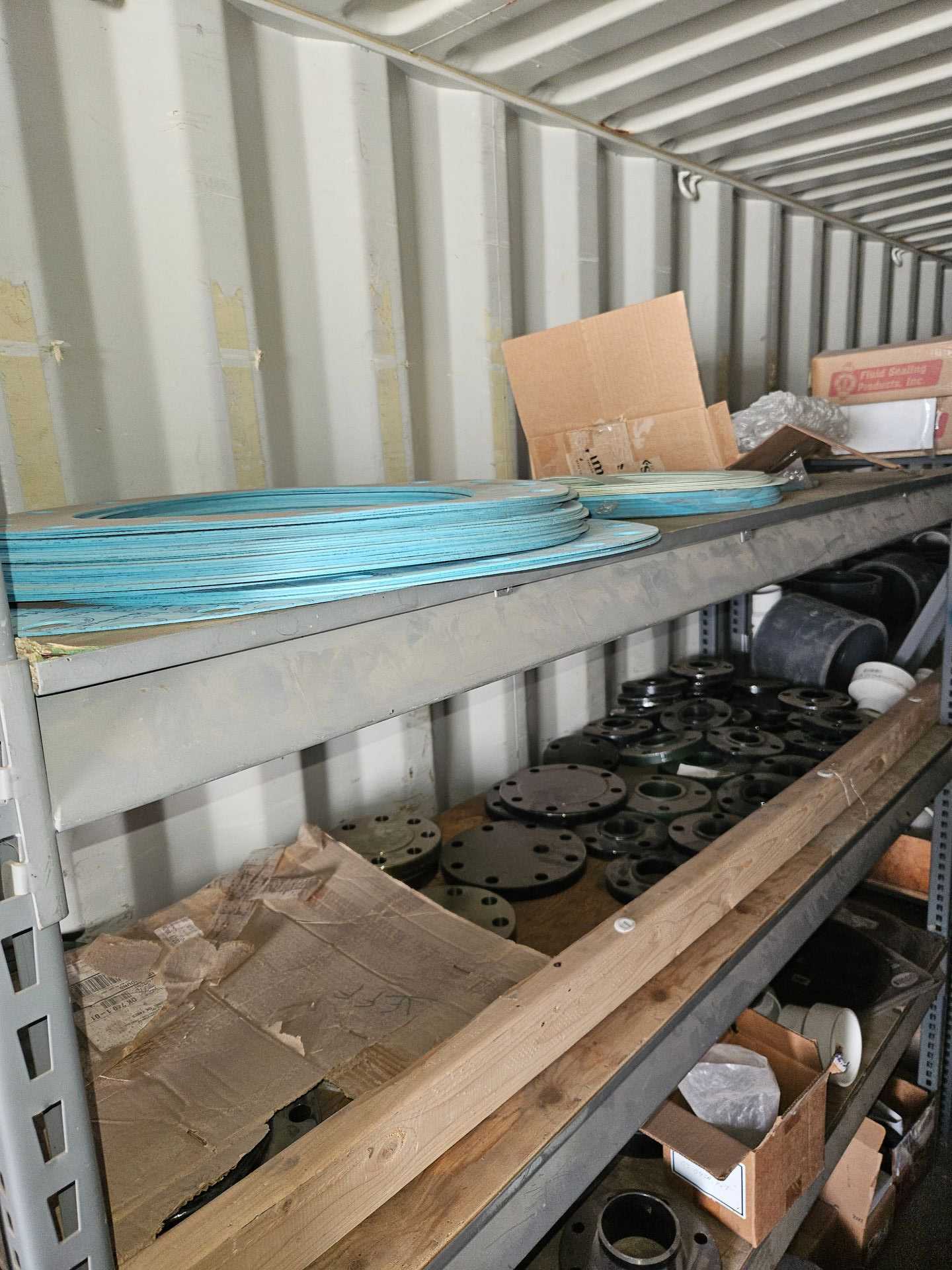 20' SHIPPING CONTAINER W/ SHELVING AND MISC SUPPLIES - TOOL STORAGE