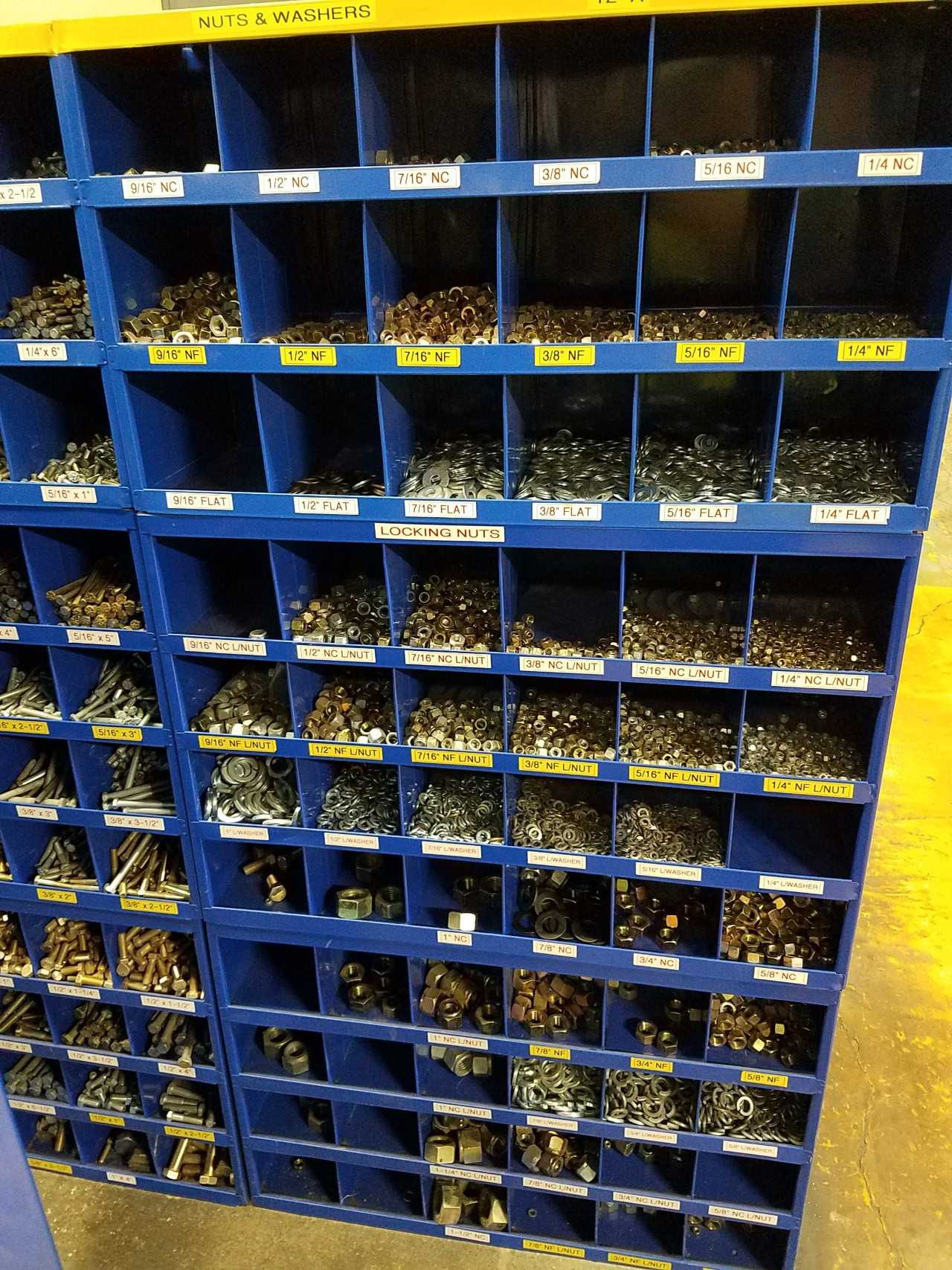 Lot of pigeon hole shelving with metal nuts, washers, and bolts - SHELVING