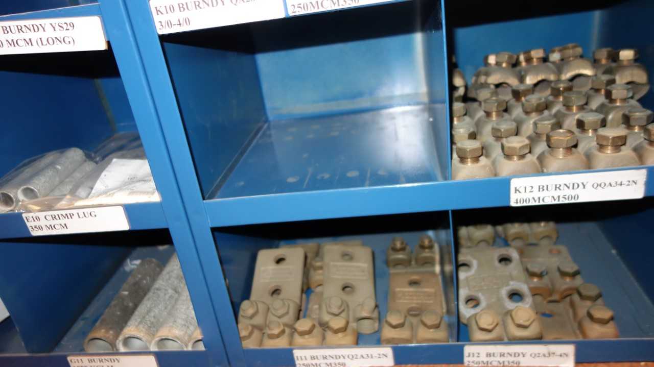 CONTENTS OF 4X STACKED PIGEON HOLE CABINET, ASSORTED TERMINAL LUGS, GROUND CLAMPS, BUS BAR CLAMPS, CONNECTORS, BURNDY - ELECTRICAL COMPONENTS