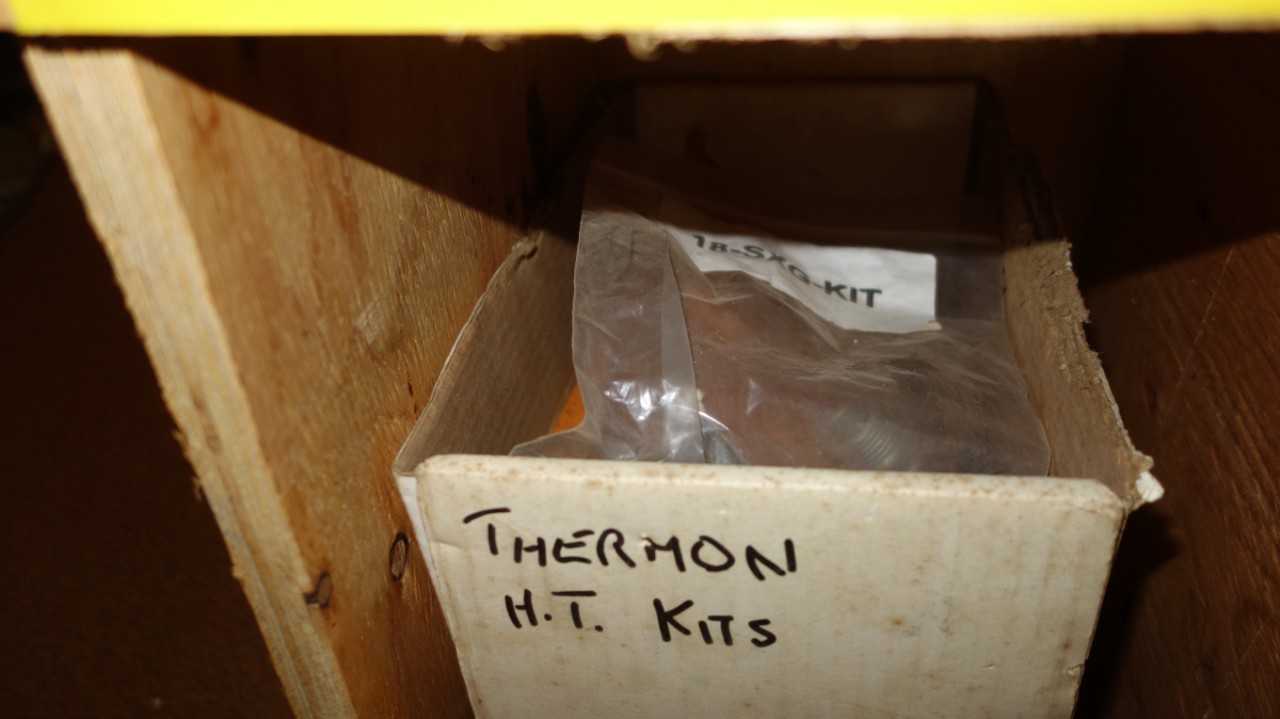 CONTENTS OF PIGEON HOLE CABINET, ASSORTED ELECTRICAL HEATING COMPONENTS, SPLICE KITS, THERMOSTAT, INSULATION SLEEVES, RAYCHEM - ELECTRICAL COMPONENTS