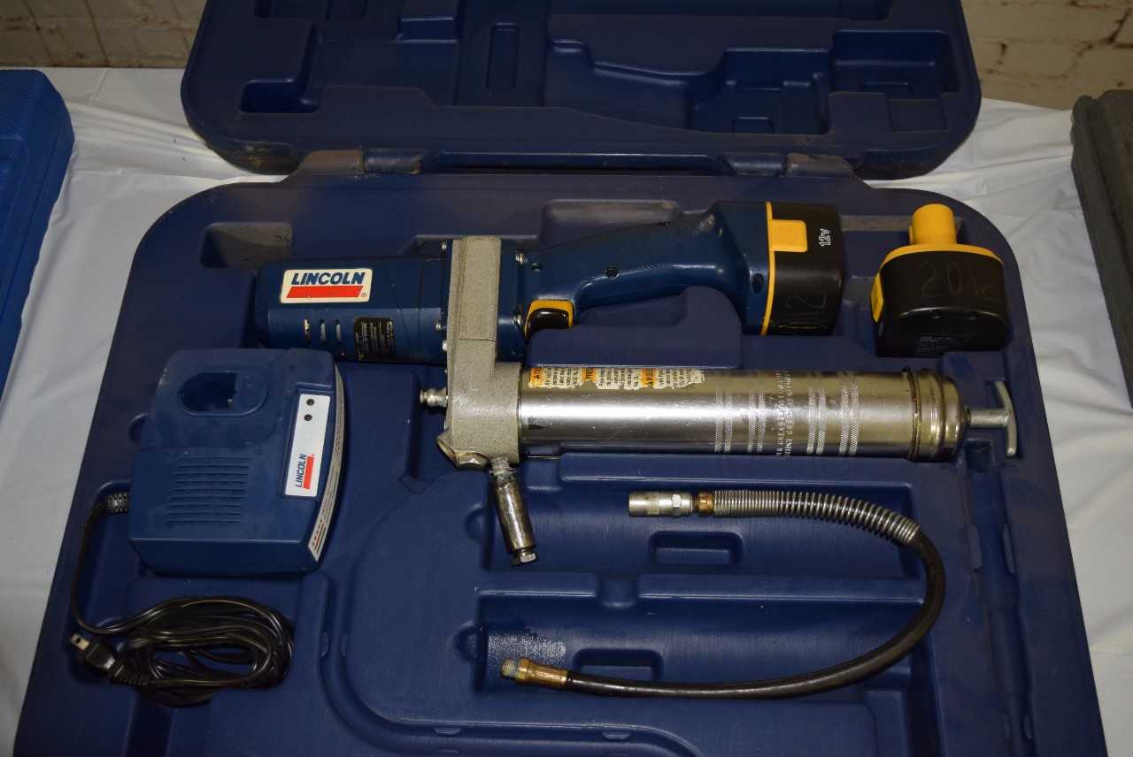 LINCOLN MODEL 1200 PORTABLE BATTERY GREASE GUN WITH ACCESSORIES AND CHARGER - MISCELLANEOUS