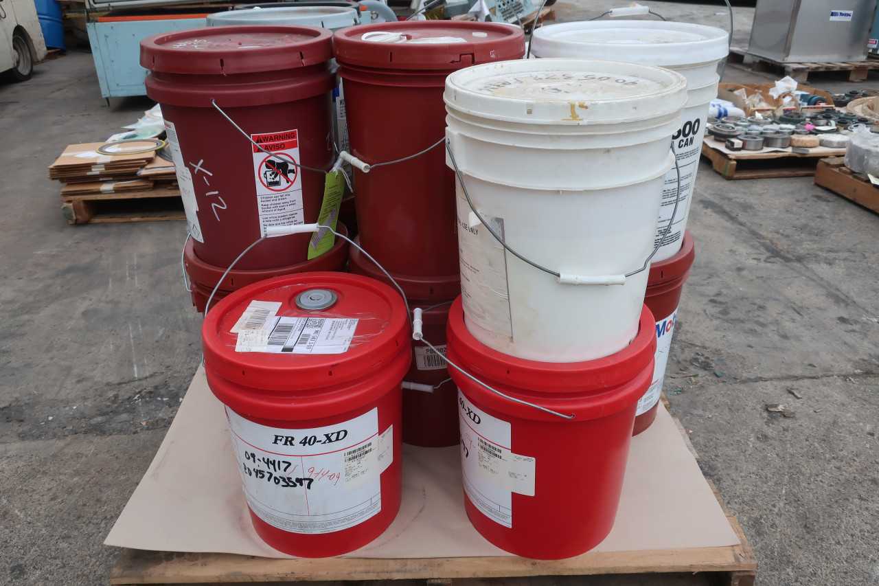 1 PALLET OF ASSORTED OIL LUBRICANTS AND CONCRETE MIX - PALLET JACKS