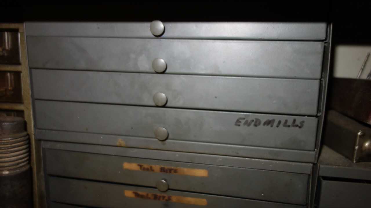 CONTENTS OF SHELVING, ASSORTED METALWORKING TOOLS, END MILLS, BOLTS, TAPS, REAMERS, WRENCHES