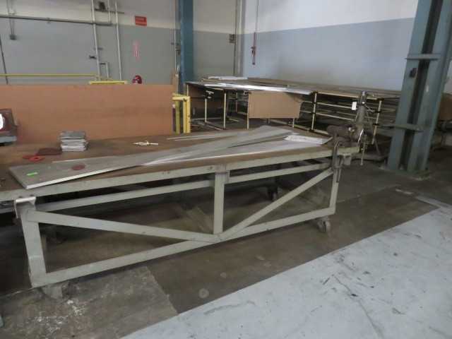 Steel table with vise and wheels. 10' Long - MATERIAL HANDLING