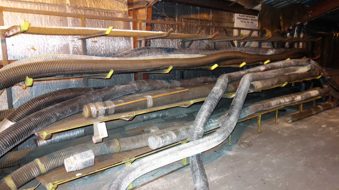 LOT OF ASSORTED HOSE ON CANTILEVER RACKNG AND BINS - ELECTRIC POWER TOOLS