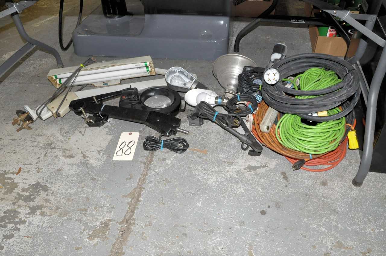 Lot-Lights and Extension Cords on Floor Under (1) Table - LIGHTING