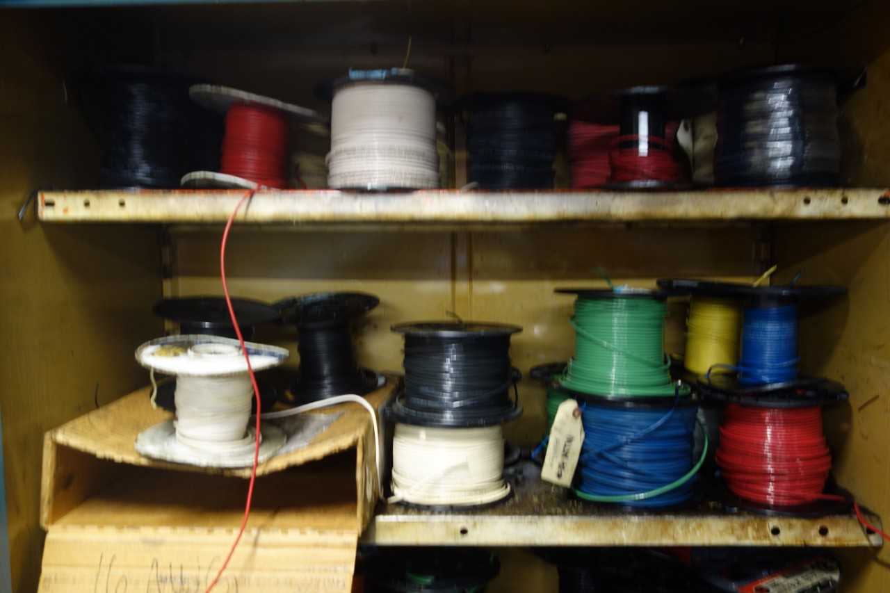 Cabinet with assorted wire and cable spools - ELECTRICAL COMPONENTS