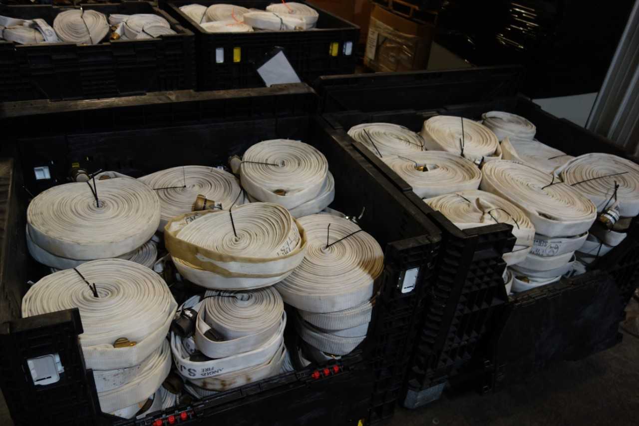 2 BINS WORTH OF 1 AND ONE HALF IN POLYFLEX FIRE HOSE   BIN NOT INCLUDED - TOOL STORAGE