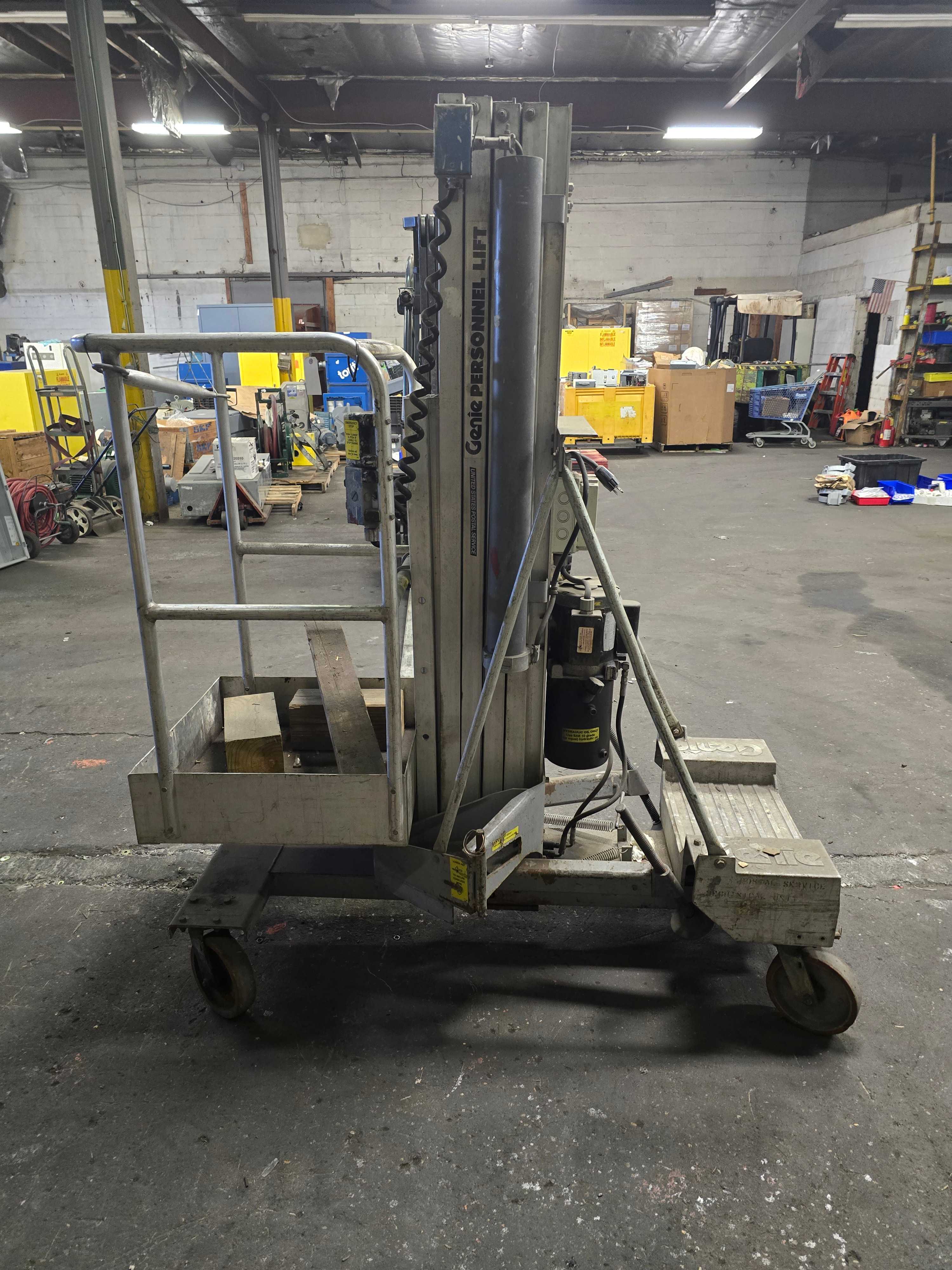 GENIE ONE MAN PERSONNEL LIFT - MATERIAL HANDLING EQUIPMENT