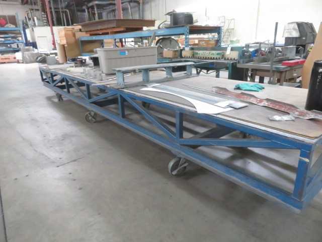 252" L X 48" wide, steel table on wheels - MISCELLANEOUS