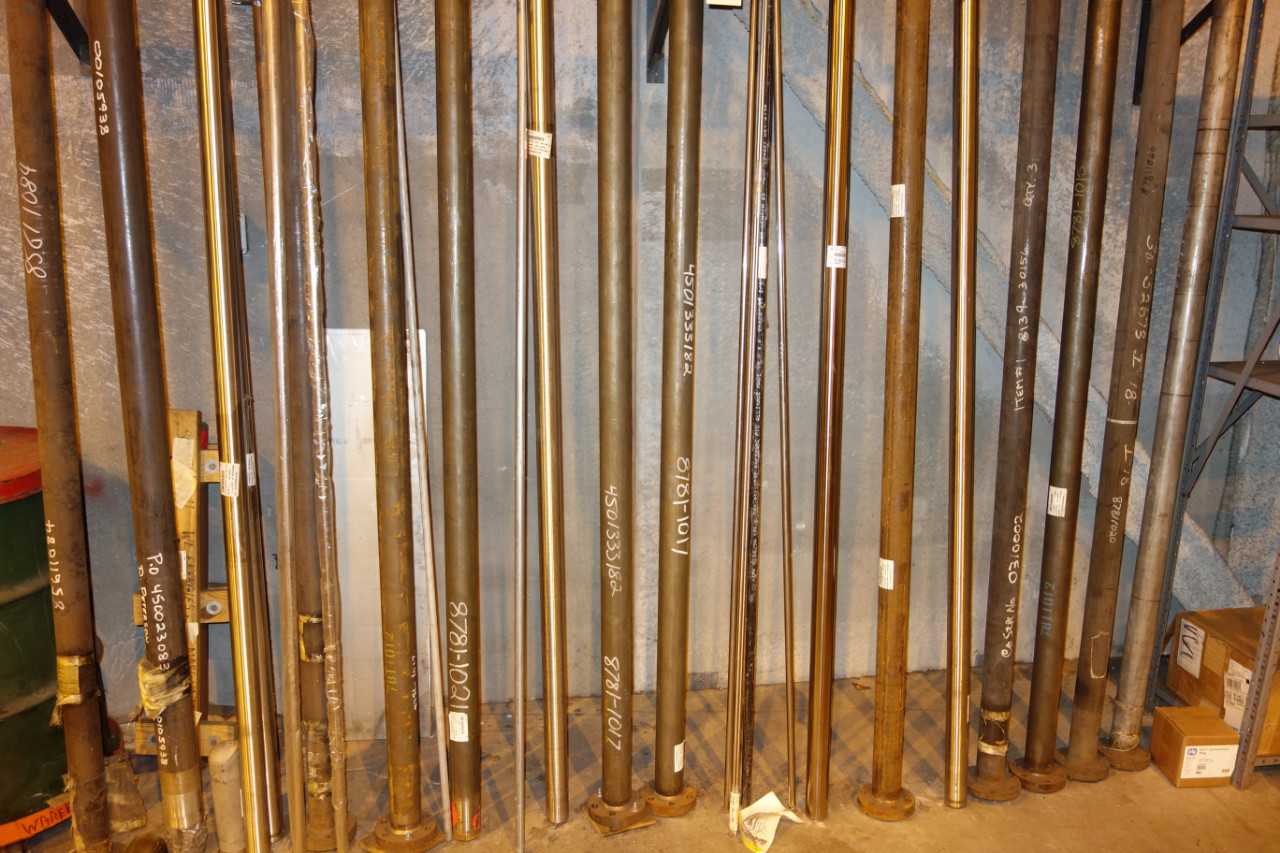 WALL OF ASSORTED BOILER TUBES, PIPES - INDUSTRIAL PARTS