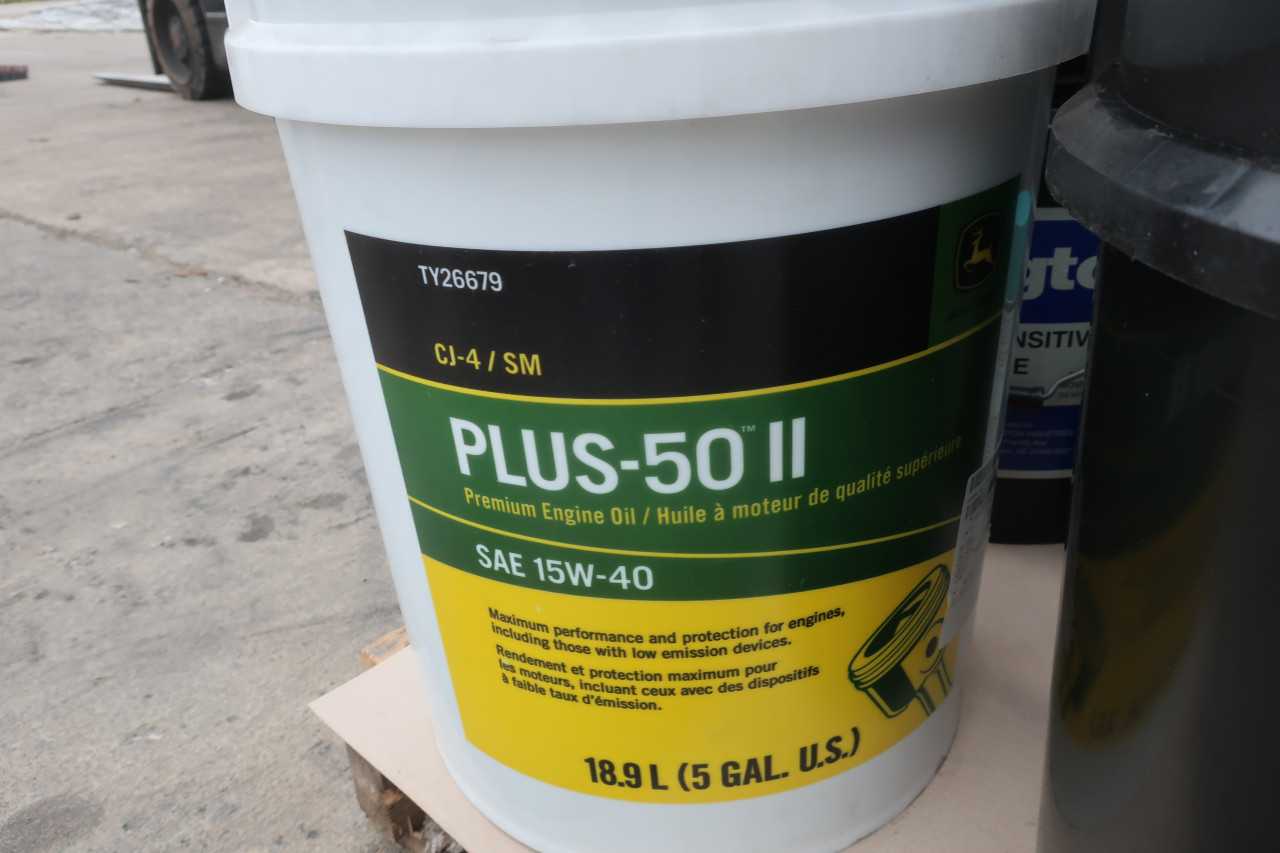 1 PALLET OF ASSORTED OIL LUBRICANTS AND CONCRETE MIX - PALLET JACKS