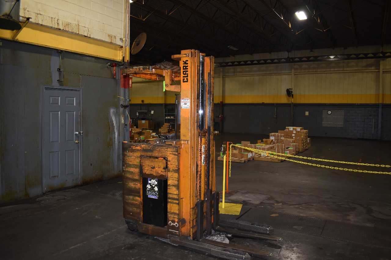 2,300 lb Clark Electric Stand up Fork lift - FORKLIFTS