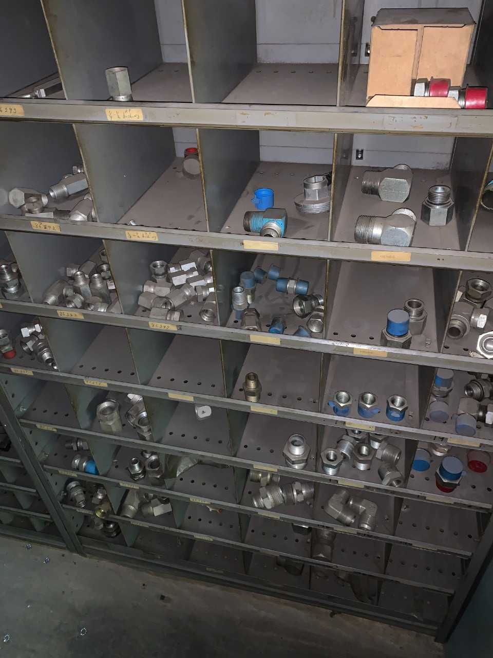 Large wall unit filled with fittings - INDUSTRIAL PARTS