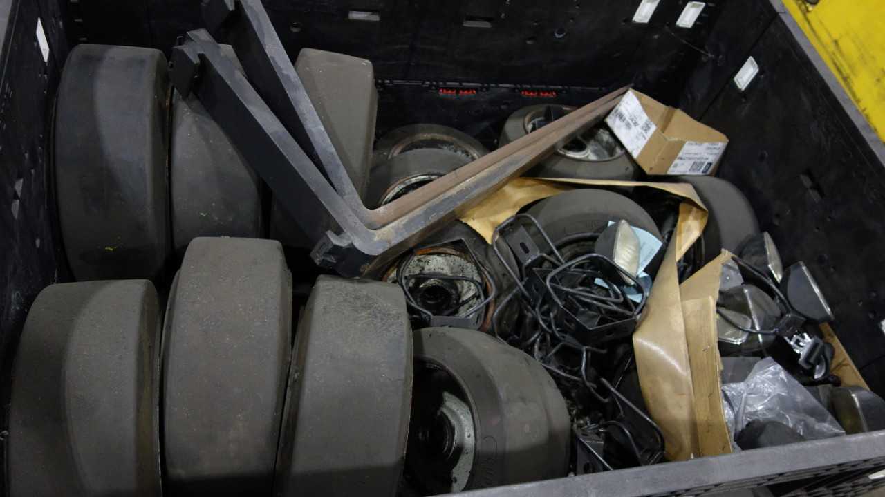1 CRATE OF ASSORTED FORKLIFT SPARES, SUPER SOLID TIRES, HEADLIGHTS, FORKS - MATERIAL HANDLING
