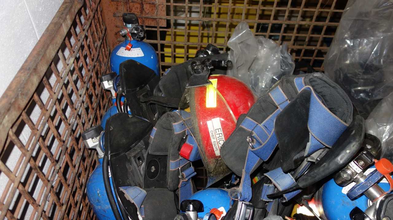 LOT OF ASSORTED FIRE PROTECTION EQUIPMENT, HARD HATS, JACKETS, EXTINGUISHERS - SAFETY EQUIPMENT