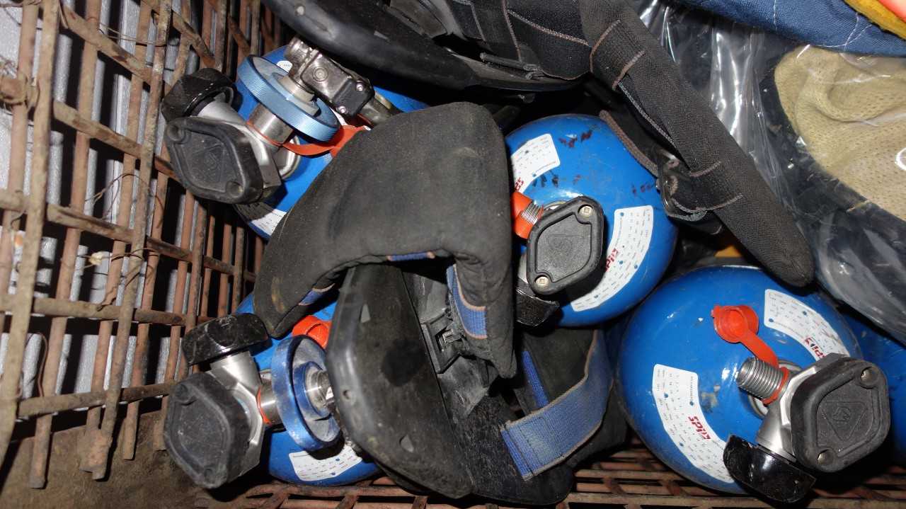 LOT OF ASSORTED FIRE PROTECTION EQUIPMENT, HARD HATS, JACKETS, EXTINGUISHERS - SAFETY EQUIPMENT