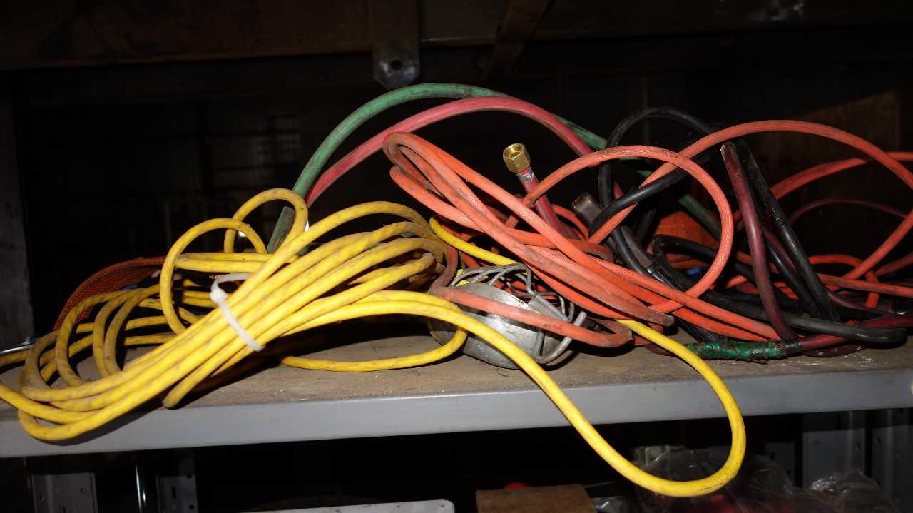 CONTENTS OF SHELF - MISCELLANEOUS ELECTRICAL CONROLS, CYLINDERS, MOTORS - ELECTRIC POWER TOOLS