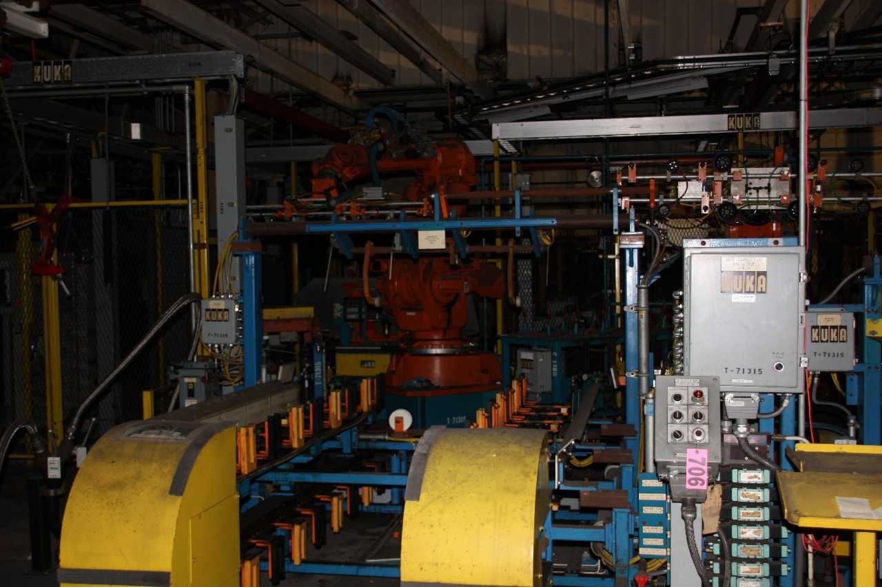 Robot cell complete with run up conveyor, robots, robot tooling, control panels - MISCELLANEOUS