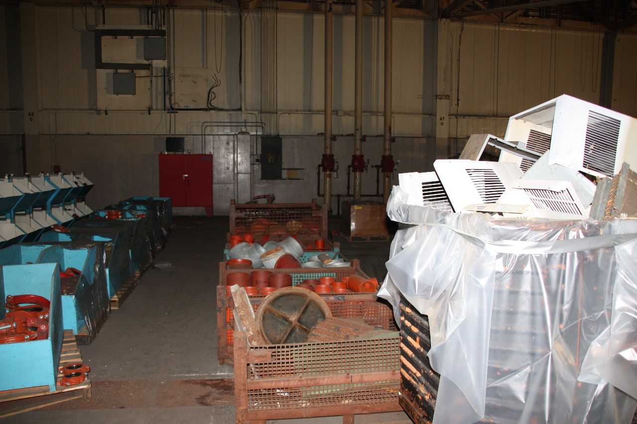 Misc. gondolas of air conditioners scrap parts, bins of pipe fittings   - MISCELLANEOUS
