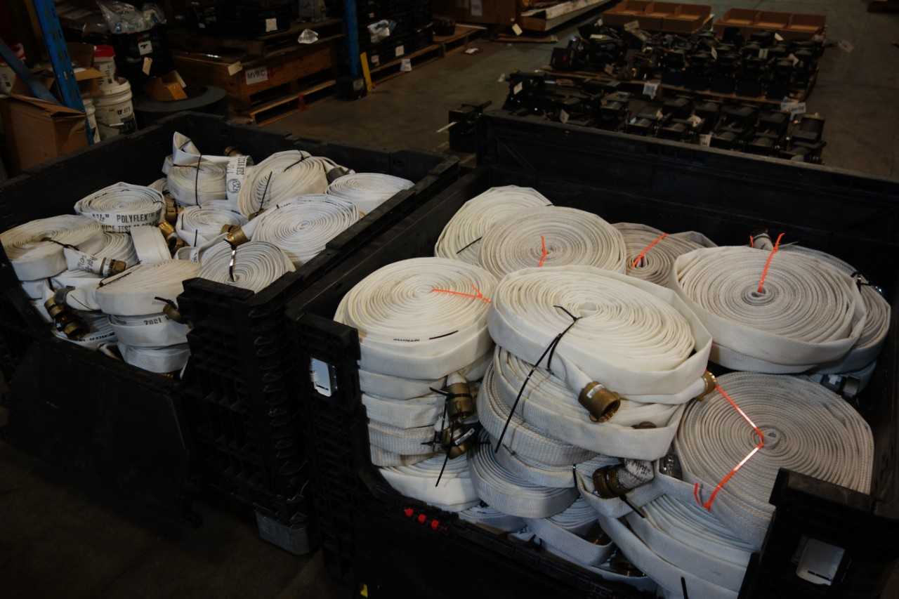 2 BINS WORTH OF 1 AND ONE HALF IN POLYFLEX FIRE HOSE   BIN NOT INCLUDED - TOOL STORAGE