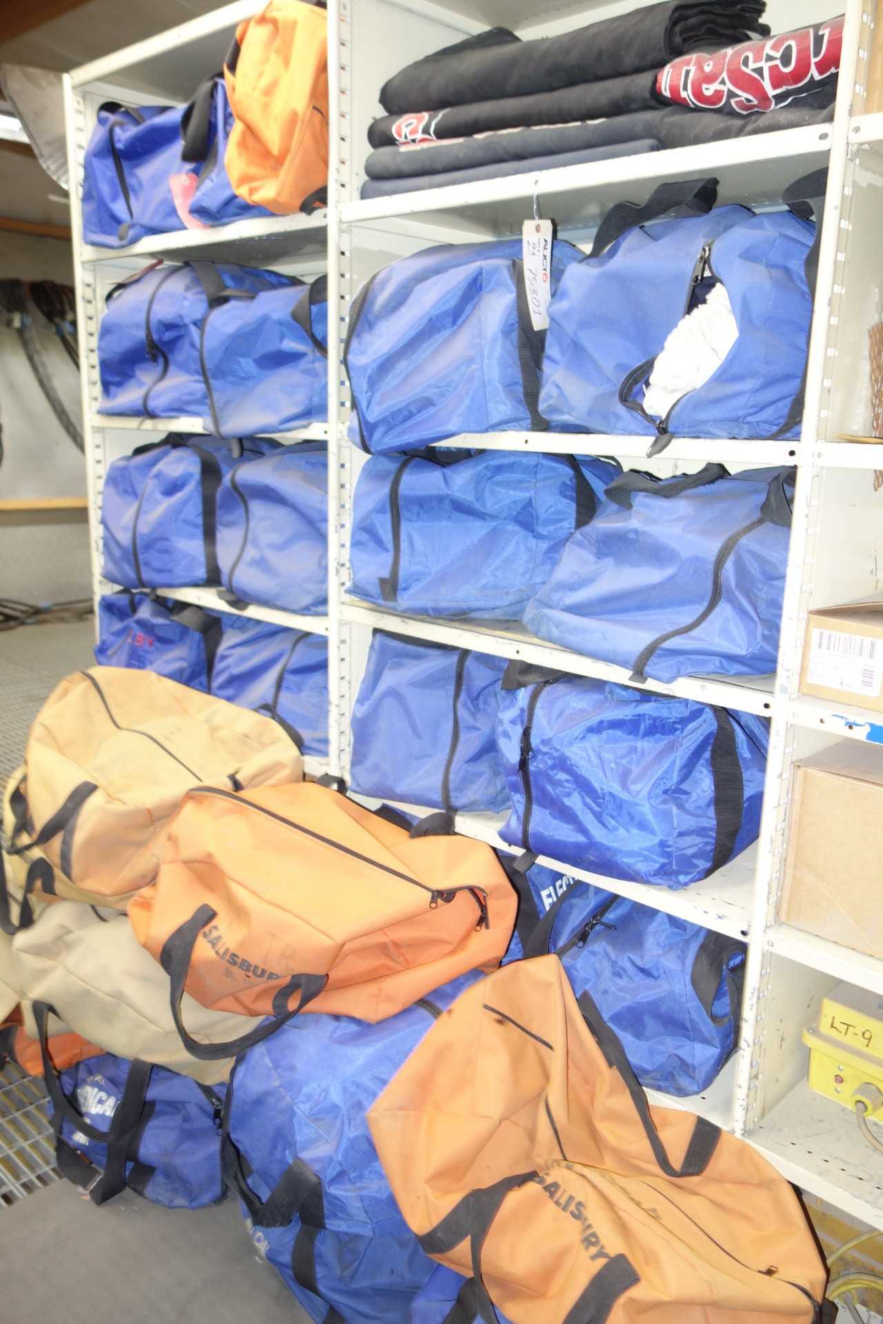 Contents of 2x sections shelving - assorted electrical safety suits and face shields - SHELVING