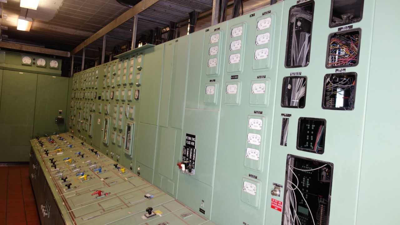 CONTENTS OF ELECTRICAL WALL, ASSORTED RELAYS, METERS, BASLER BS1-25A AUTOMATIC SYNCHRONIZER (DELAYED REMOVAL) - ELECTRICAL COMPONENTS