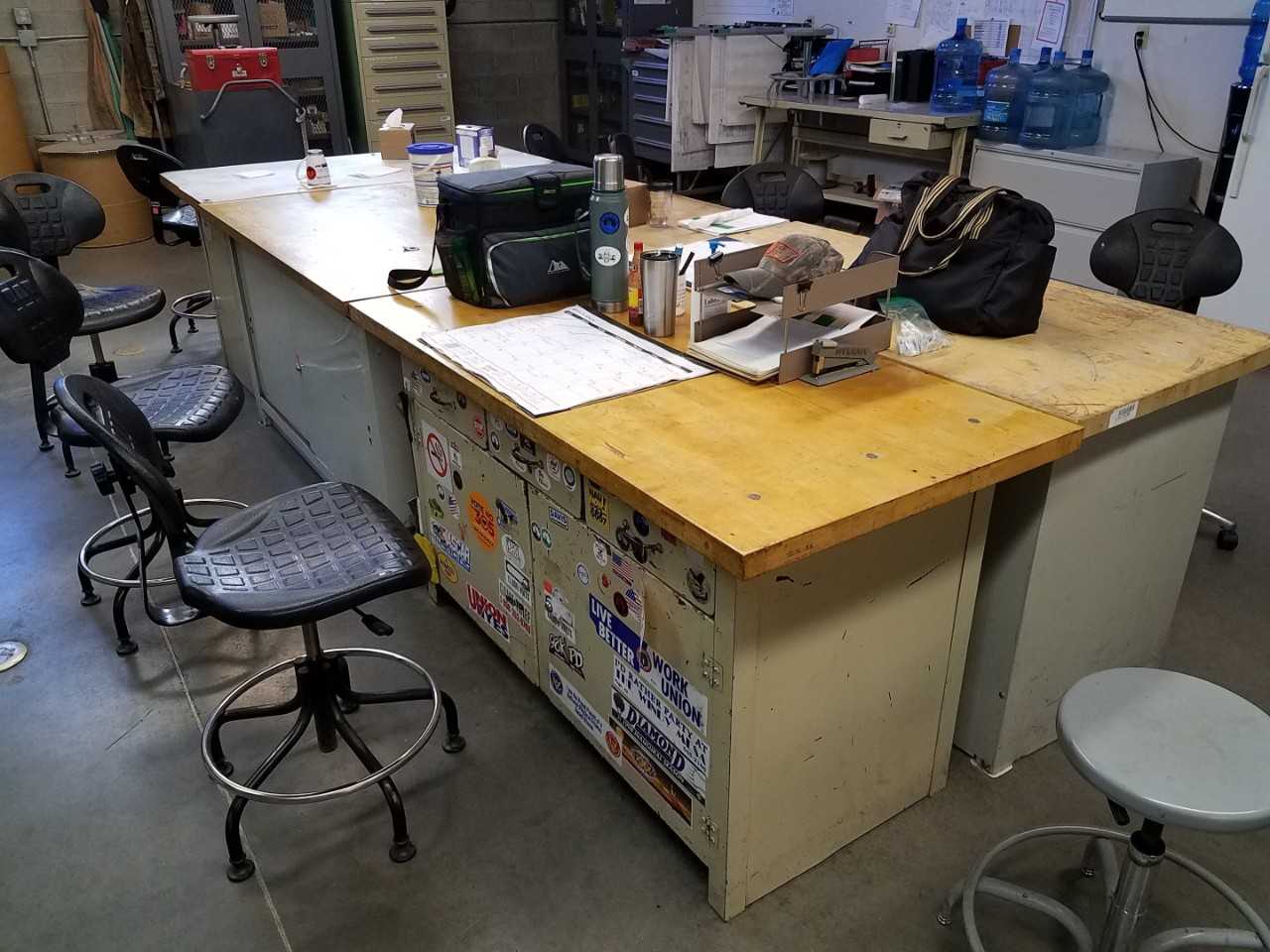 Lot of 4 60" x 30" steel work desks with wood surfaces - MATERIAL HANDLING Lot of 4 60" x 30" steel work desks with wood surfaces - MATERIAL HANDLING