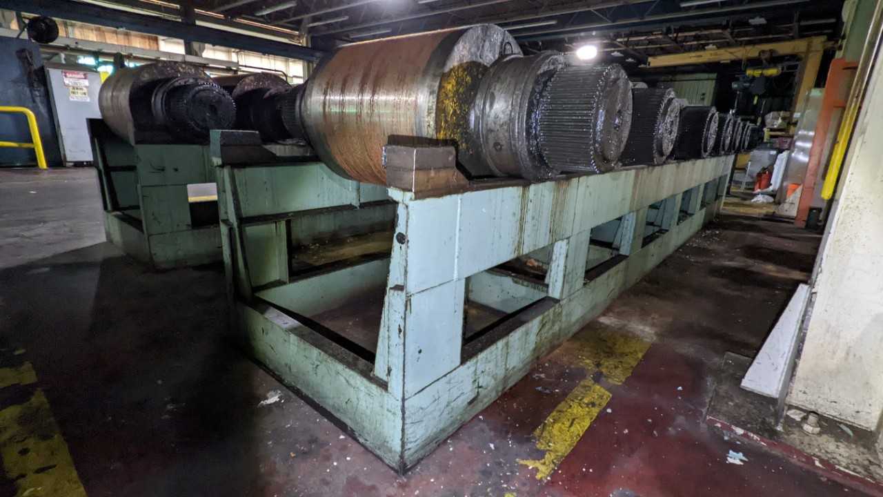 Lot of 7 steel rolls with rack