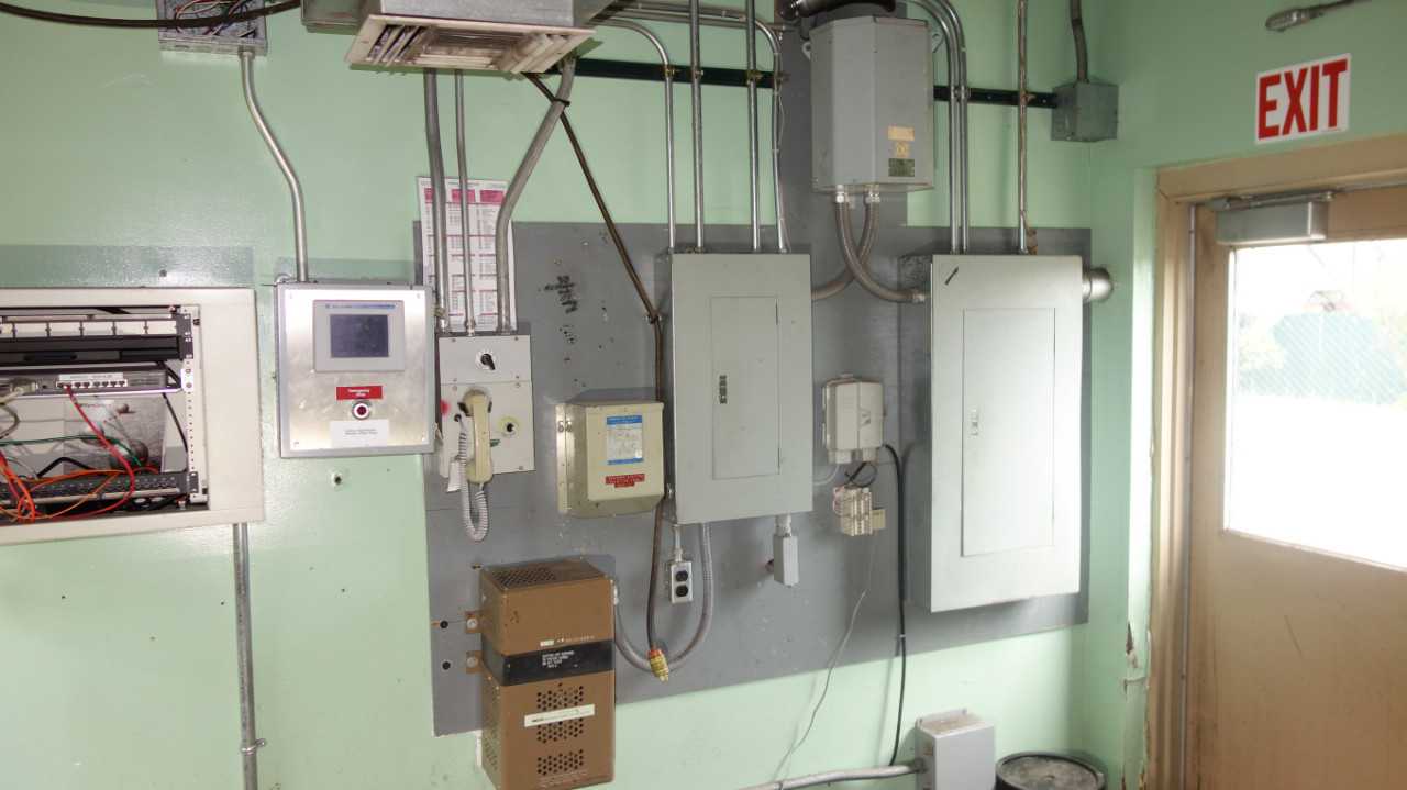 CONTENTS OF WALL SECTION, ASSORTED CONTROL BOXES - ELECTRICAL COMPONENTS
