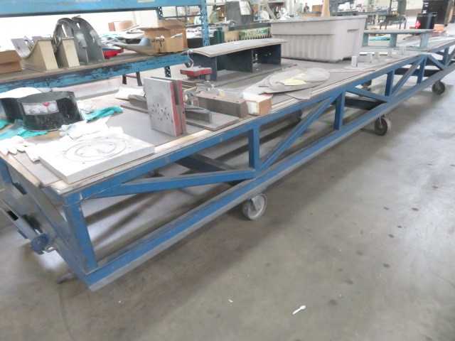 252" L X 48" wide, steel table on wheels - MISCELLANEOUS