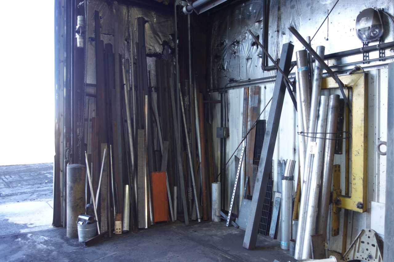 WALL OF ASSORTED STEEL, PIPING - TOOL STORAGE