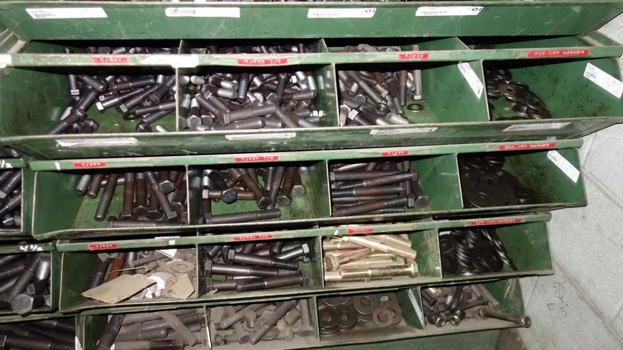 SHELVES OF ASSORTED THREADED SCREWS AND NUTS - INDUSTRIAL PARTS