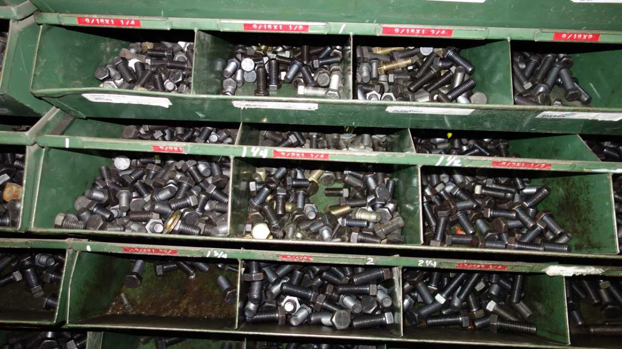 SHELVES OF ASSORTED THREADED SCREWS AND NUTS - INDUSTRIAL PARTS
