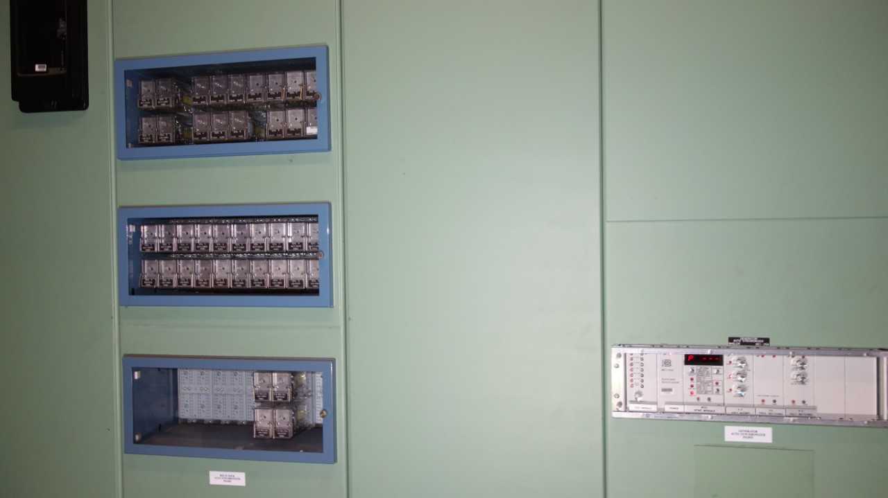CONTENTS OF ELECTRICAL WALL, ASSORTED RELAYS, METERS, BASLER BS1-25A AUTOMATIC SYNCHRONIZER (DELAYED REMOVAL) - ELECTRICAL COMPONENTS