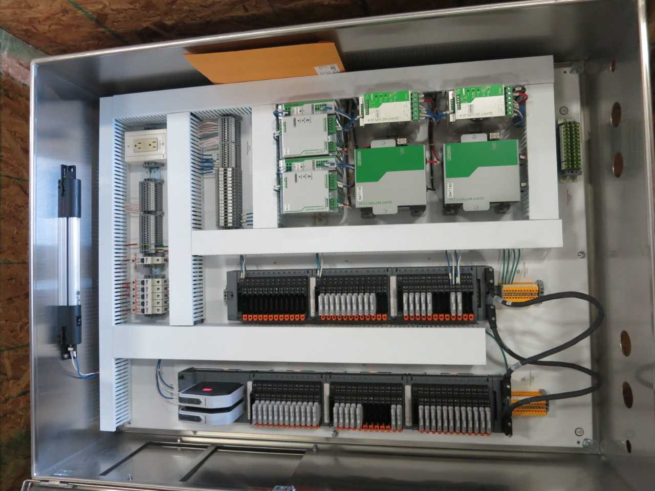 STAINLESS ENCLOSURE WITH ASSORTED EMERSON OVATION DCS MODULES AND PHOENIX CONTACT POWER SUPPLIES - AUTOMATION & CONTROLS