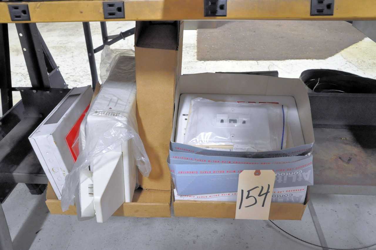 Lot Illuminated Exit Signs in 2 Boxes Under 1 Table - ELECTRIC POWER TOOLS